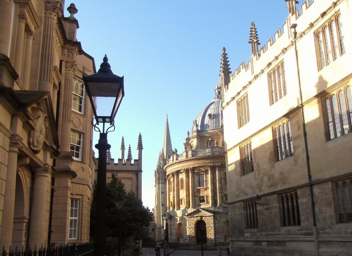 An old university courtyard with ivy-covered stone buildings